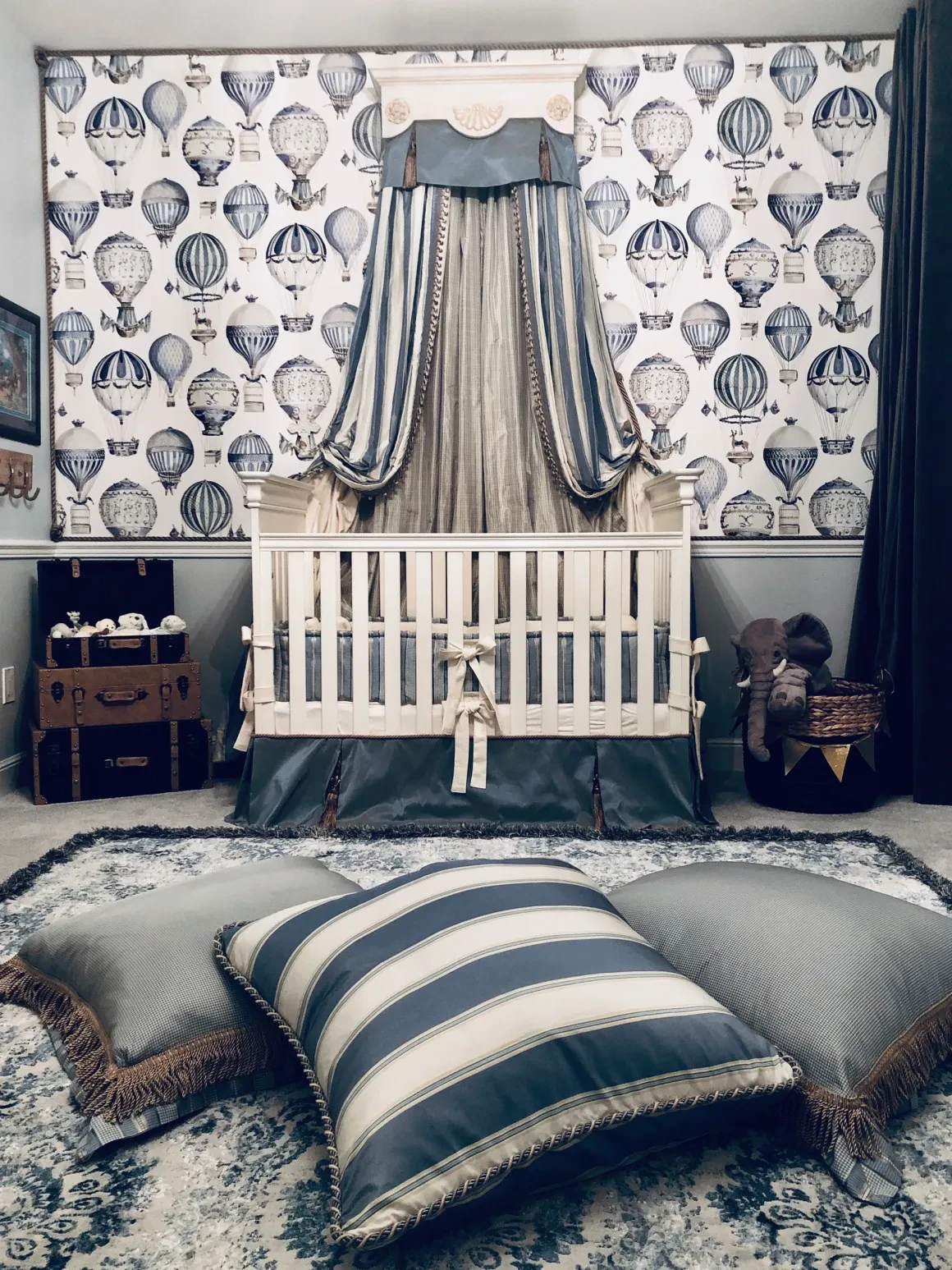 Blue and white nursery with hot-air-balloon wallpaper