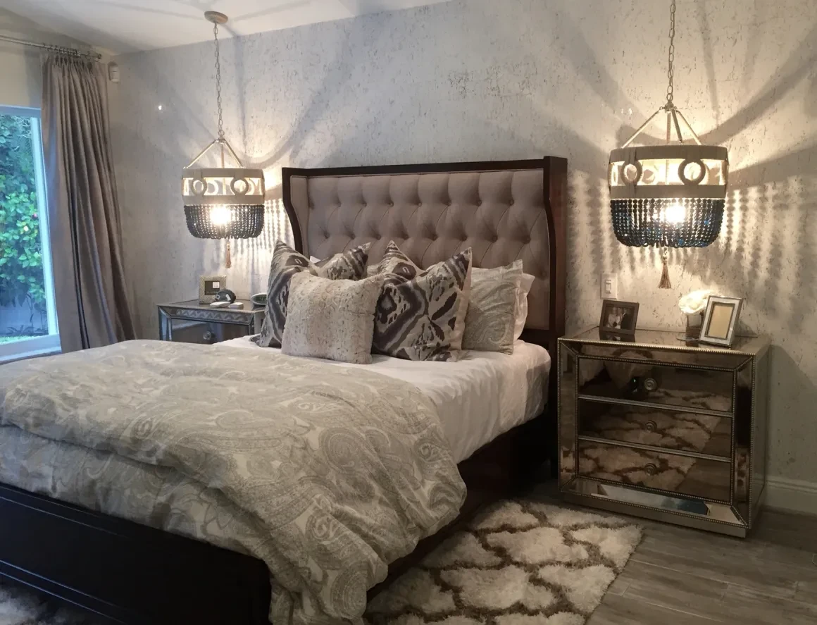Elegant bedroom with tufted bed and pendant lighting