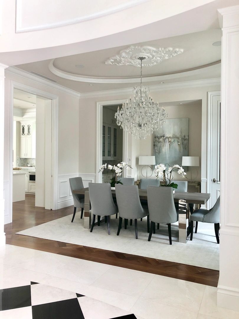 Formal dining room with crystal chandelier and tailored furnishings
